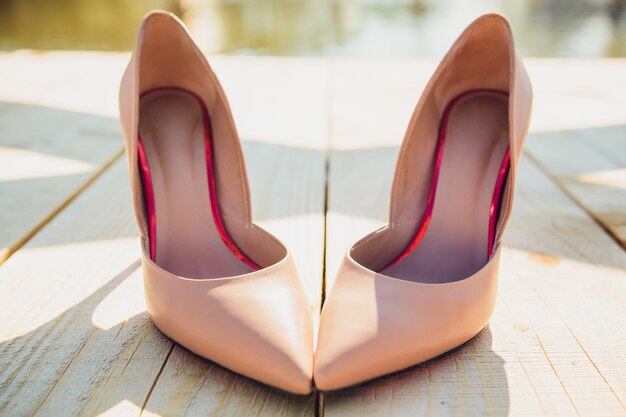 Bride Putting On Wedding Shoes