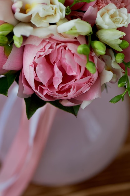 The bride's bouquet of soft pink peonies and white roses Wedding floristryClassic form