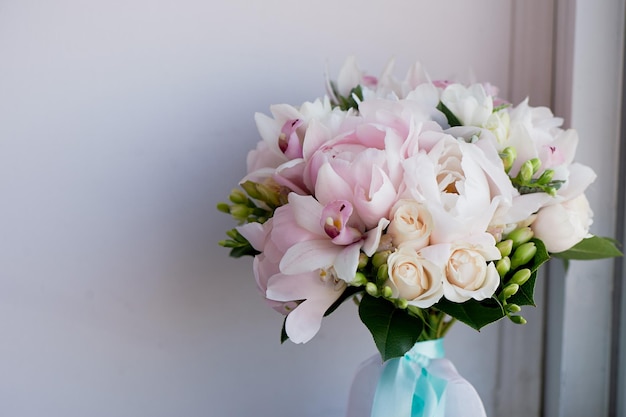 The bride's bouquet of soft pink peonies and white roses Wedding floristryClassic form