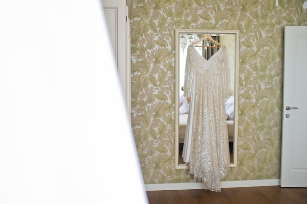 Bride's dress in the hotel room.