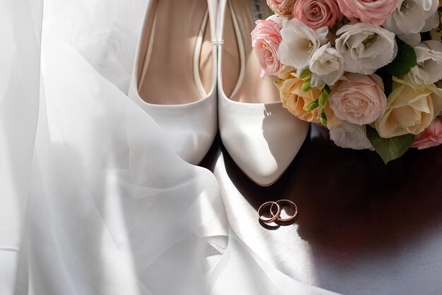 Bride's shoes bouquet wedding rings preparations before the ceremony