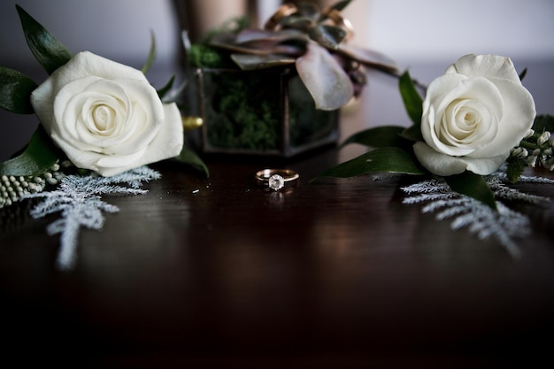 A bride's shoes with wedding rings and decor