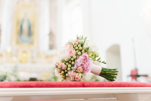 The bride's wedding bouquet is on the table