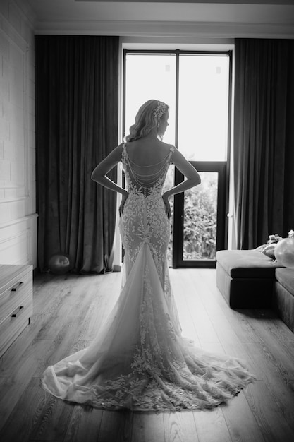 Bride standing in a hotel room