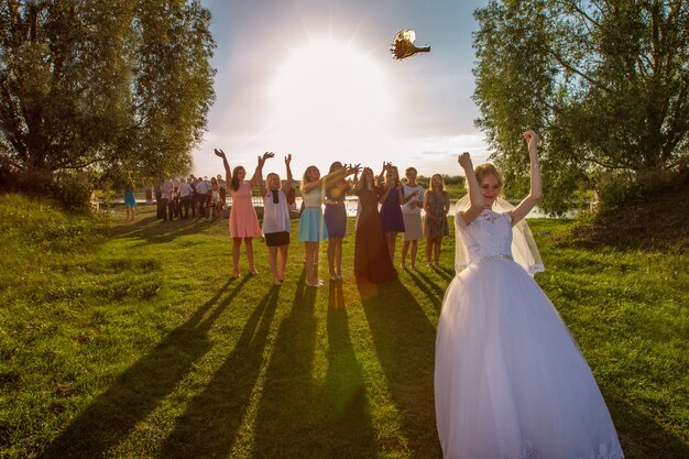 The bride throws a bouquet