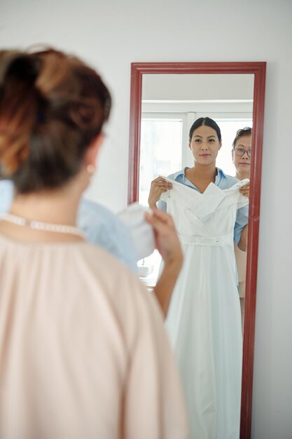 Bride Trying on Wedding Dress