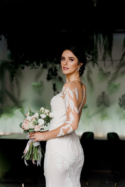 Bride in wedding dress in cafe.