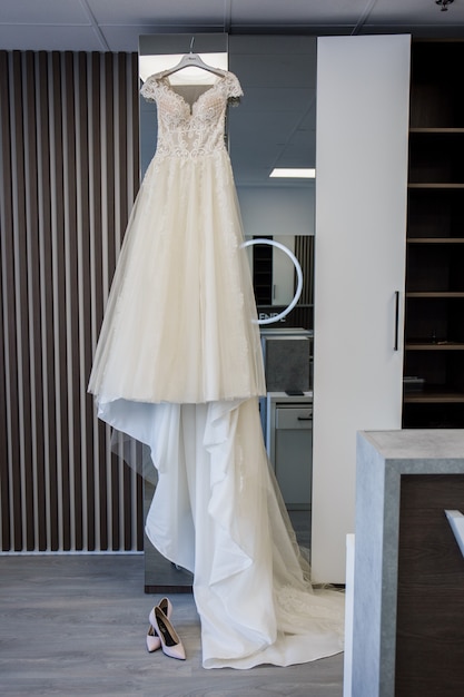 Bride wedding dress hanging on the closet