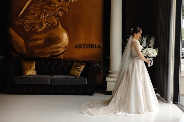 a bride in a wedding dress is standing in front of a large poster that says  clari