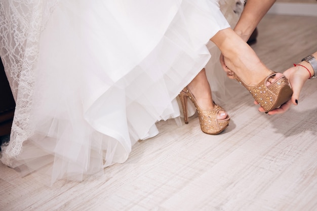 Bride in wedding dress shoes. Bridesmaid shoes