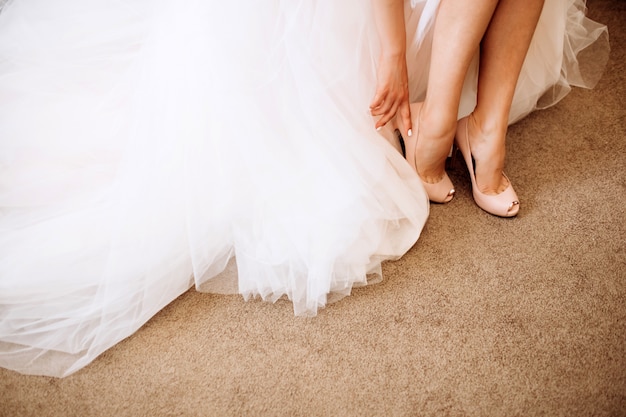 Photo bride in wedding dress shoes. bridesmaid shoes