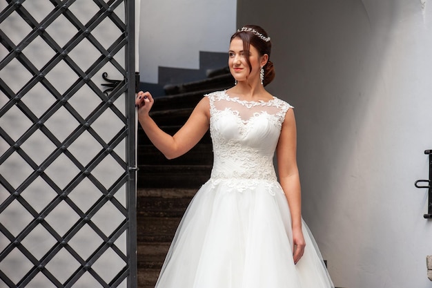 Bride in a wedding dress on the stairs