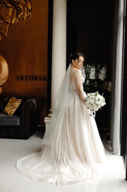 a bride in a wedding dress stands in front of a large sign that says  citi