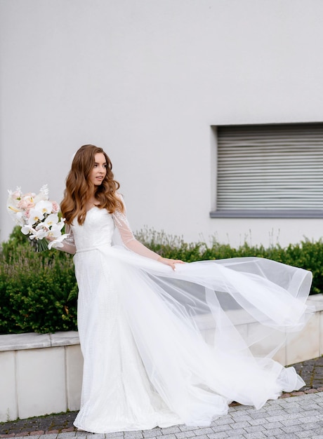 Bride in wedding dress with bouquet of flowers