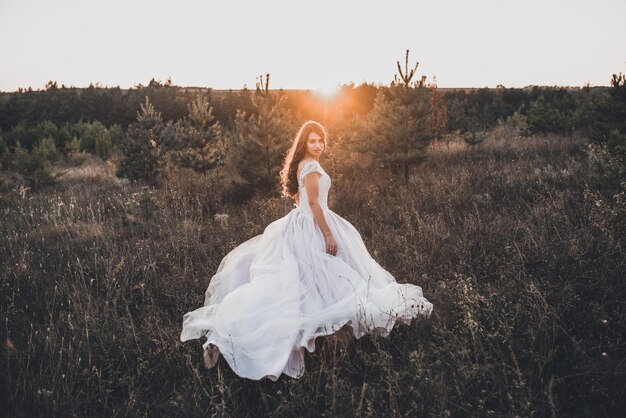 Bride in wedding white dress walking