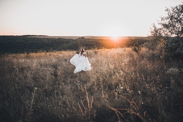 Bride in wedding white dress walking