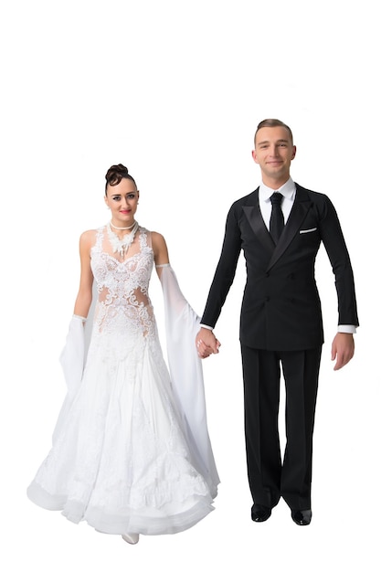 Bride in white dress and groom in tuxedo isolated on white Couple in love of ballroom dancers in love Sensual woman and man Valentines day celebration Wedding or proposal and date concept