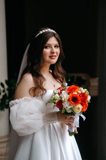 Photo a bride in a white dress with flowers on her head