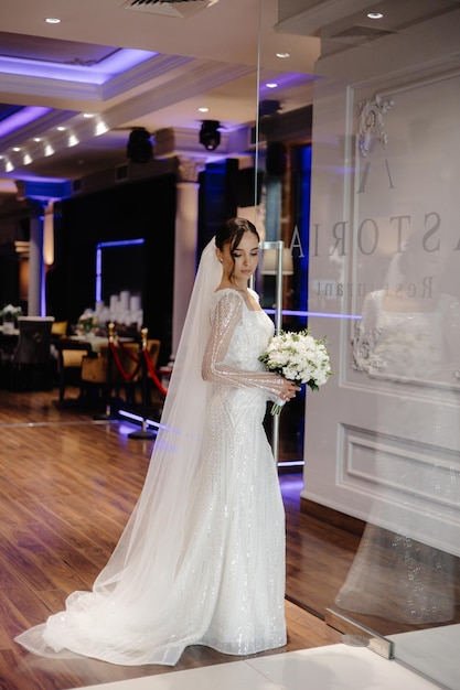 a bride in a white dress with the word bar on it