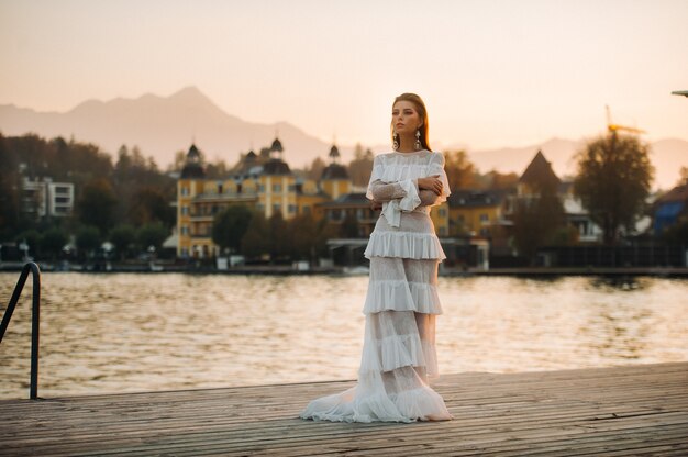 Bride in white wedding dress in the old town