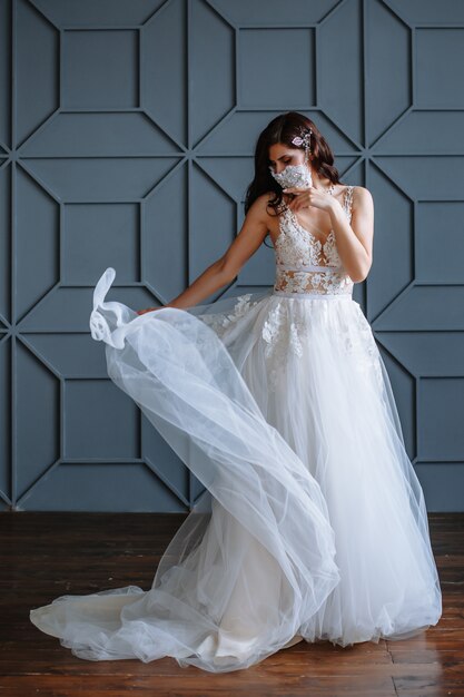 Bride in with a handmade wedding antiviral mask on her face