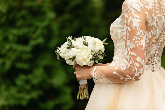 Bride with wedding bouquet at wedding day