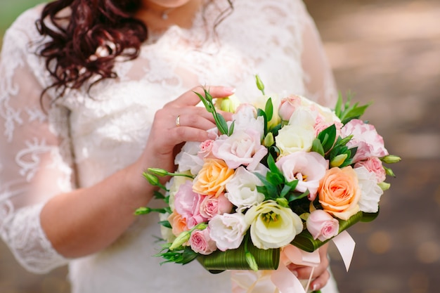 Bride with wedding bouquet.