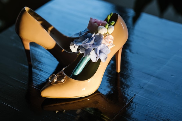 Brides accessories pretarations for wedding day, shoes and buttohole