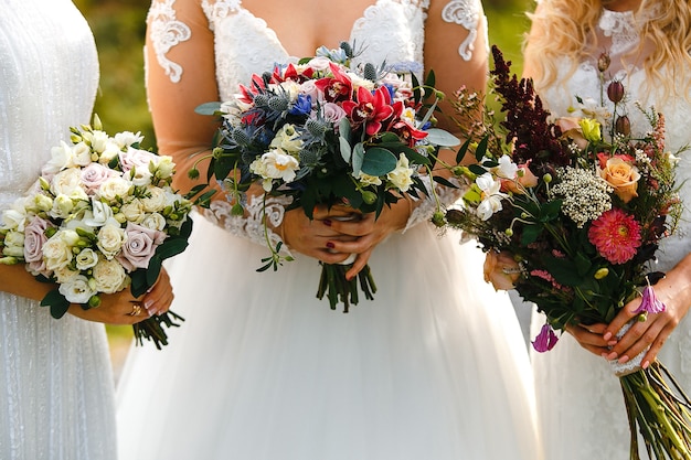 brides with flowers bouquets