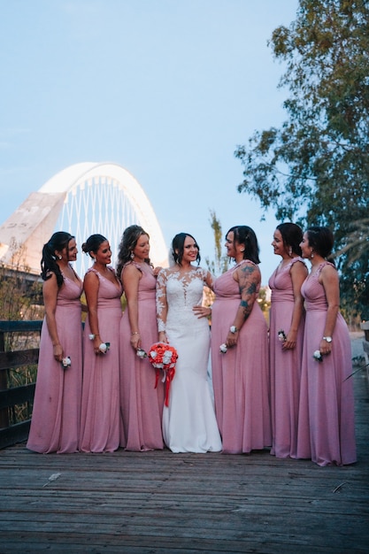 Bridesmaids looking at the bride