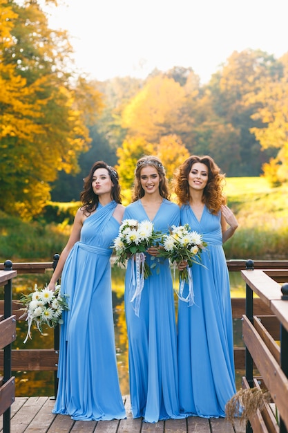 Bridesmaids in park on the wedding day