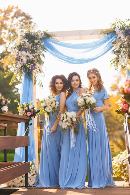 Bridesmaids in park on the wedding day