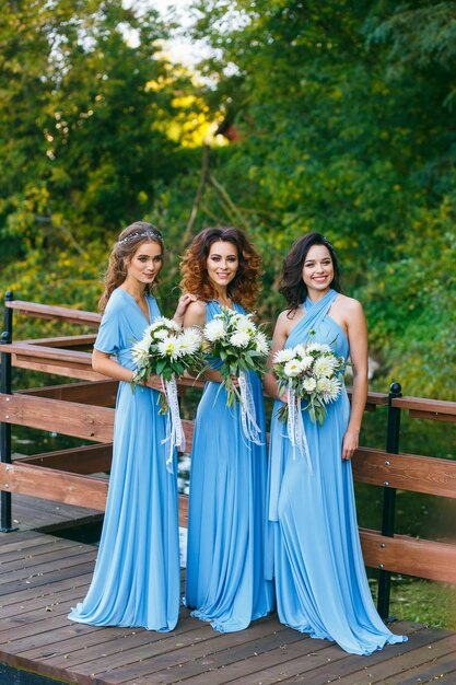 Bridesmaids in park on the wedding day