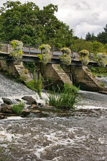 Bridge over canal against sky