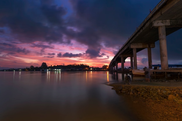 Bridge over dawn water the sunrise