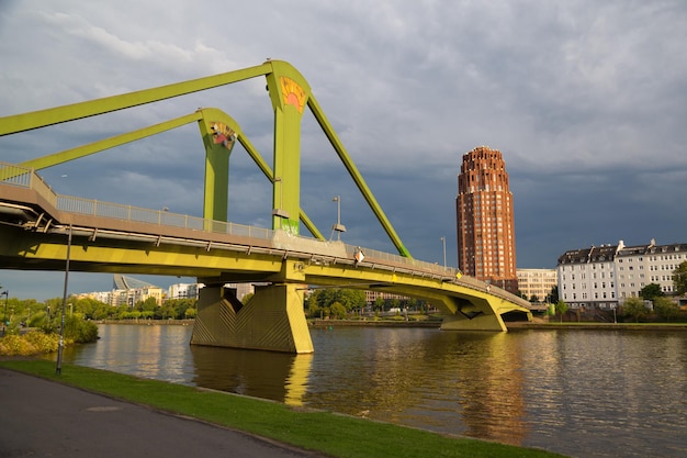 Bridge Floesser across the river Main at sunset View from the embankment Frankfurt am Main city Germany