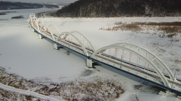 Bridge over frozen lake during winter