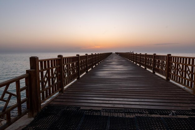 bridge or pier in sunrise over the red sea