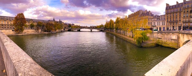 Bridge over river against buildings in city