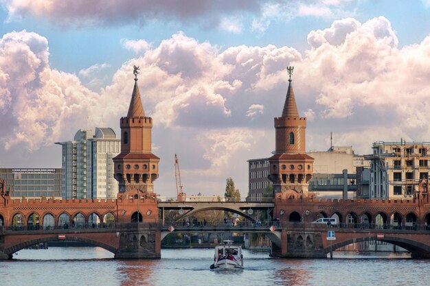 Bridge over river against buildings in city