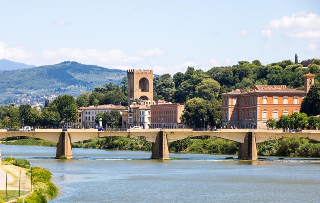 Bridge over river against buildings