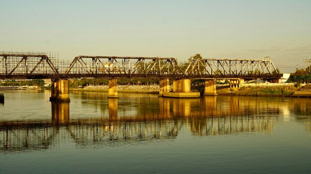 Bridge over river against clear sky