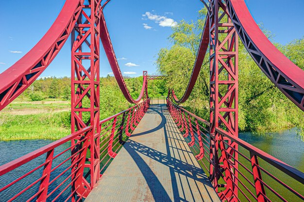 Photo bridge over river against sky