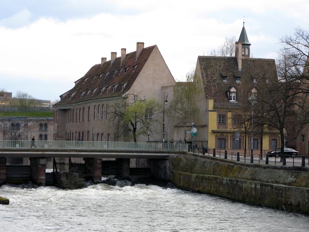 Bridge over river Ile. Strasbourg. Old houses. France. Bubbling water. Spring