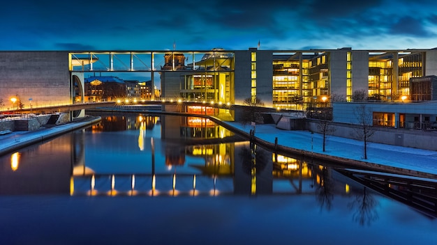 Bridge over river with buildings in background