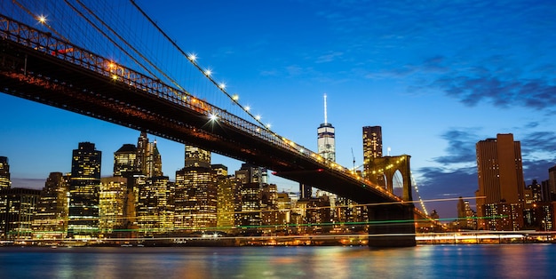 Bridge over river with buildings in background