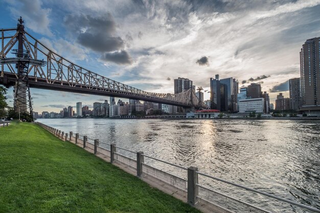 Bridge over river with buildings in background