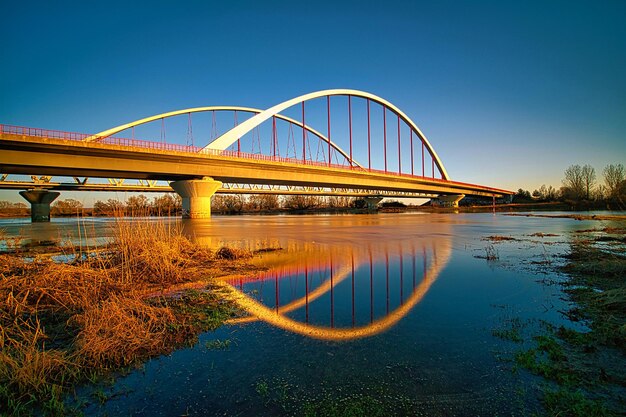 Photo bridge over river