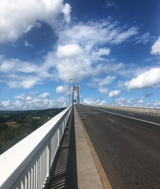 Bridge over road against sky