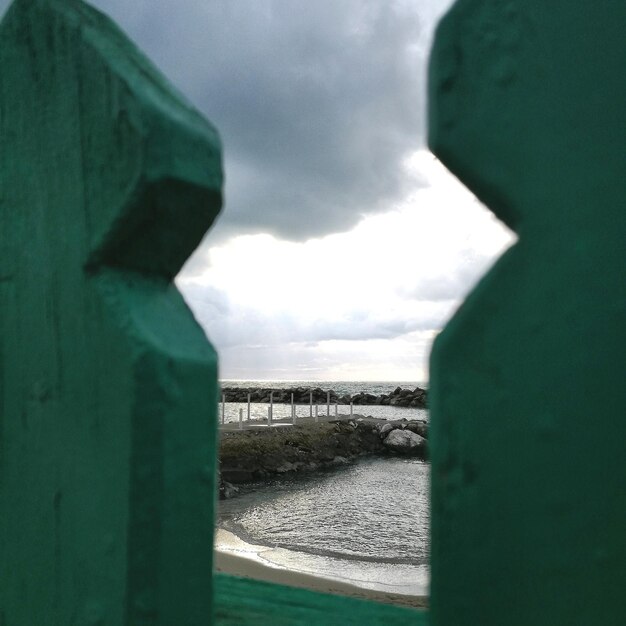 Bridge over sea against sky